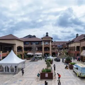 Wide open-air piazza and multi-level modern architecture of The Hub Karen mall in Nairobi.