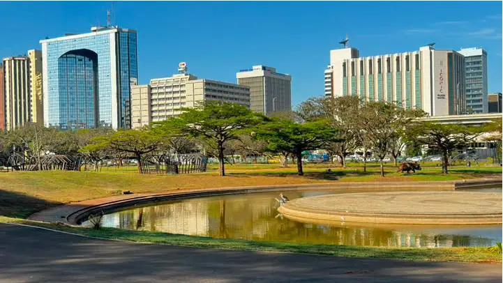 Upgraded Nairobi Central Park thumbnail showing the brand new concrete skating zone with smooth bowls, families riding rental bikes on paved trails, and vibrant greenery.